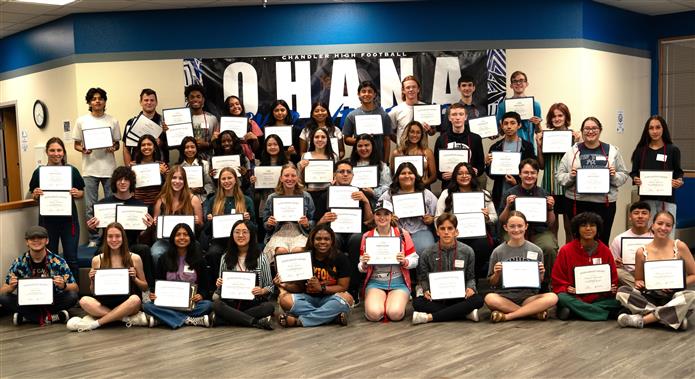 A group photo of 42 scholarship recipients at Chandler High School in 2024.